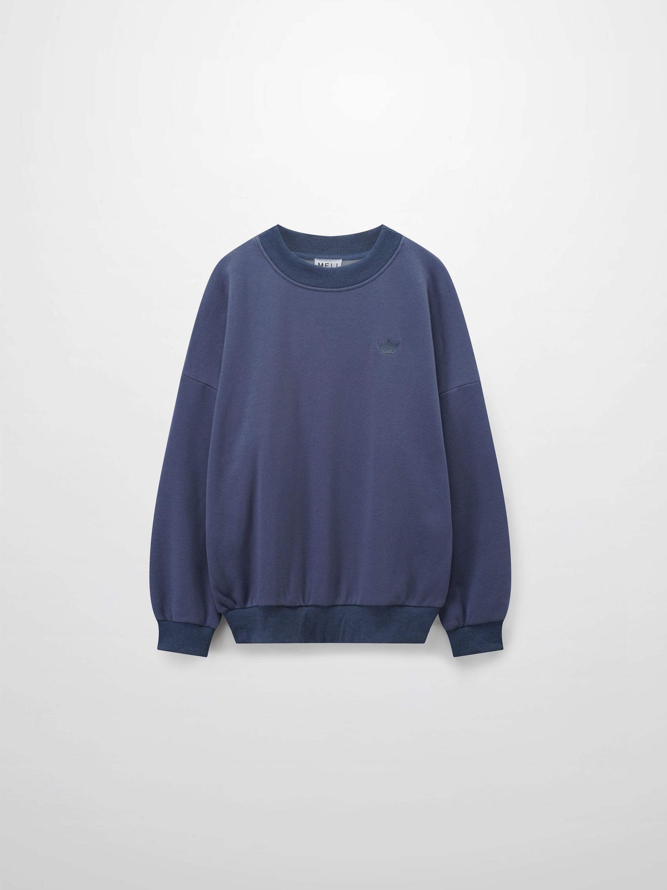 A full, front view of the dusty-blue sweatshirt. It has a ribbed crewneck collar, cuffs, and bottom hem, with the small, tone-on-tone embroidered logo visible on the left chest.