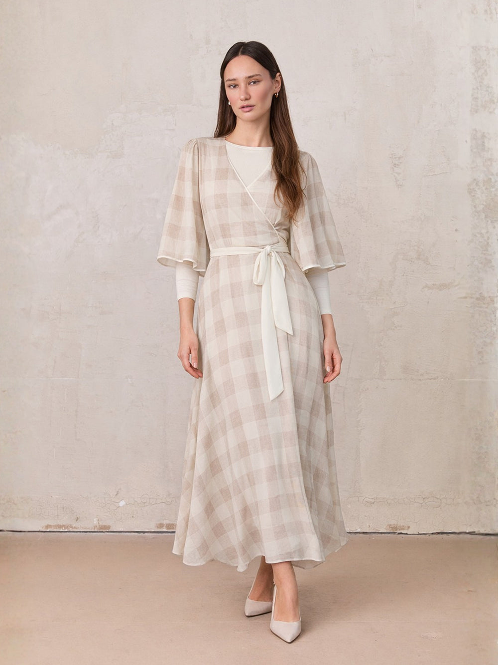 long sleeve tan dress Double Down Front Ruched L The Flutter Sleeve Wrap Dress in Tan Gingham is a timeless piece that effortlessly combines elegance with everyday wearability Tan Long Sleeve Cut Out