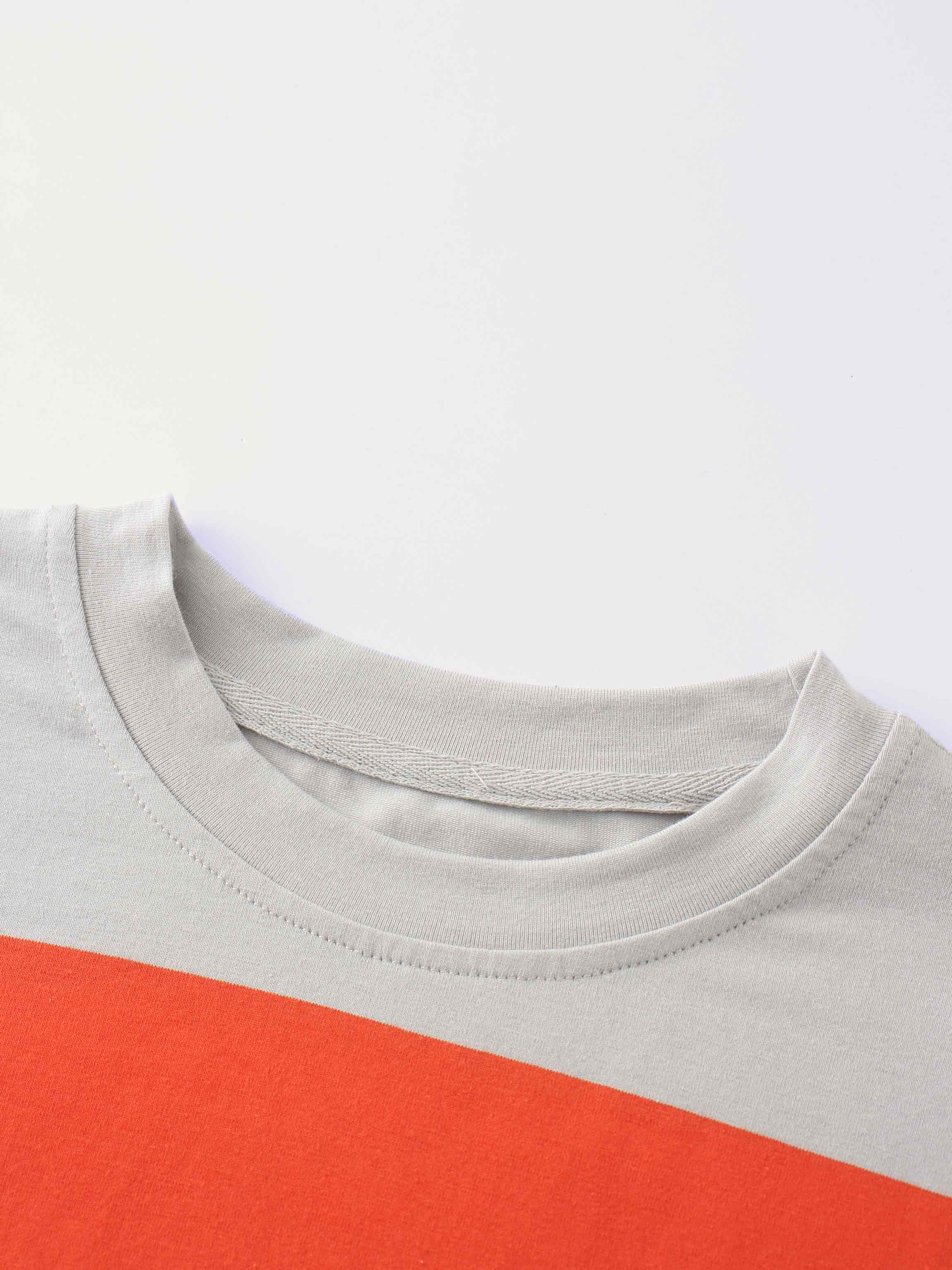 Collar of a striped orange and grey shirt.