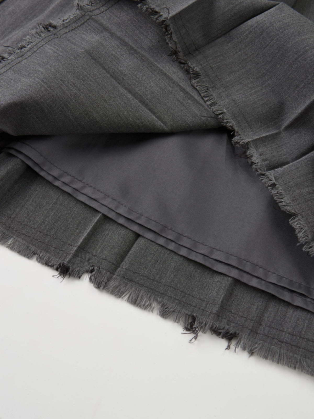 Curved Yoke Fringe Bottom Pleat Skirt SHORT- Grey