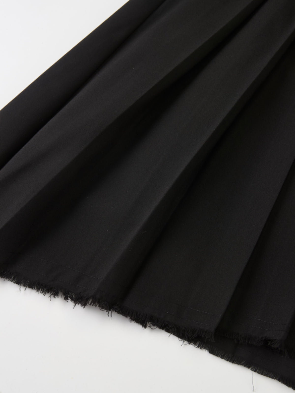Curved Yoke Fringe Bottom Pleat Skirt SHORT - Black