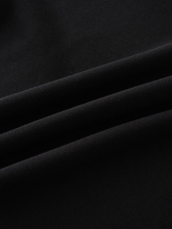 A full, front view of the black sweatshirt. The image shows the ribbed collar, cuffs, and hem, along with the subtle, black-on-black embroidered logo on the chest and a white tag inside the neckline.
